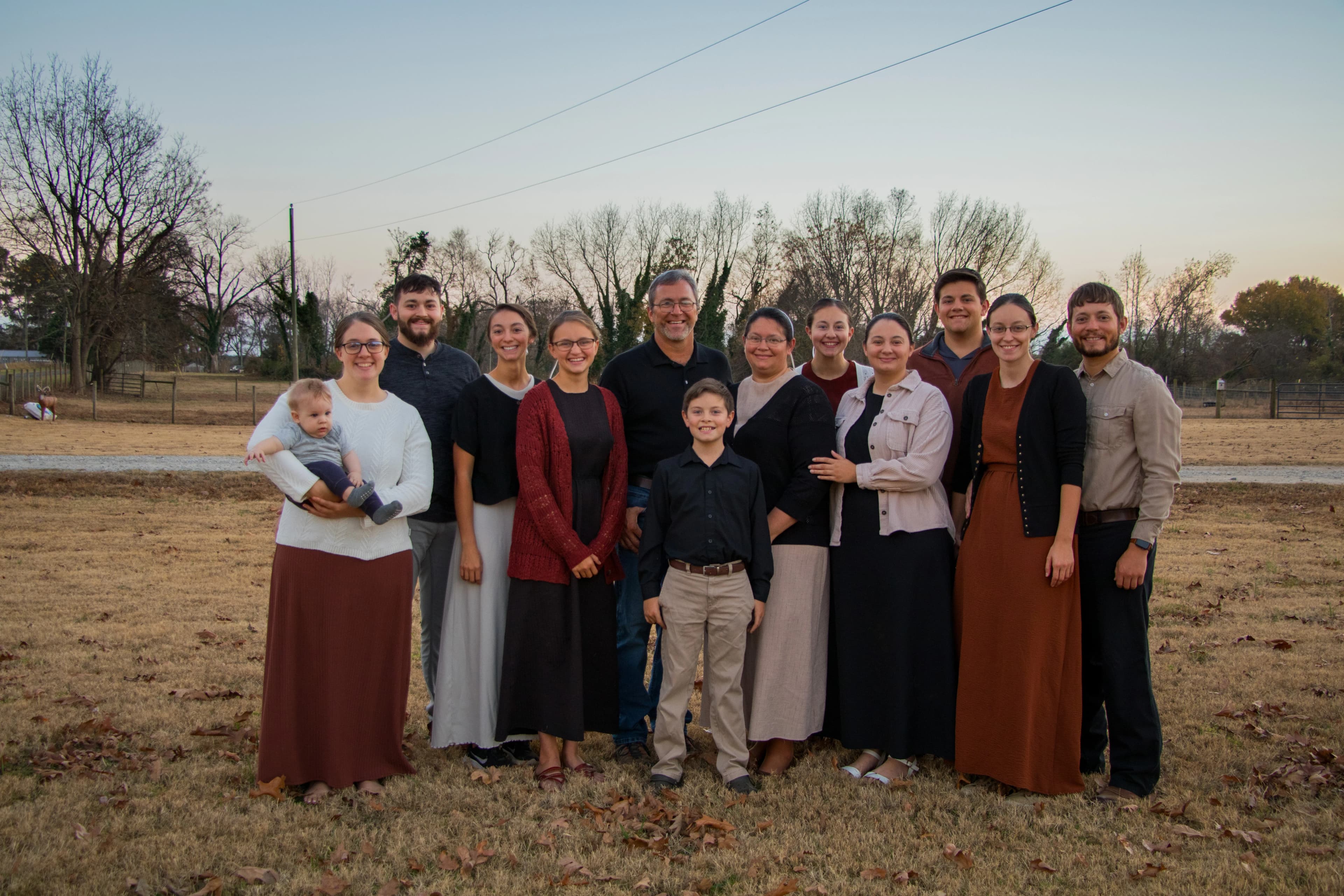 Isaac Yoder, owner of Yoder's Boom Service, with his family